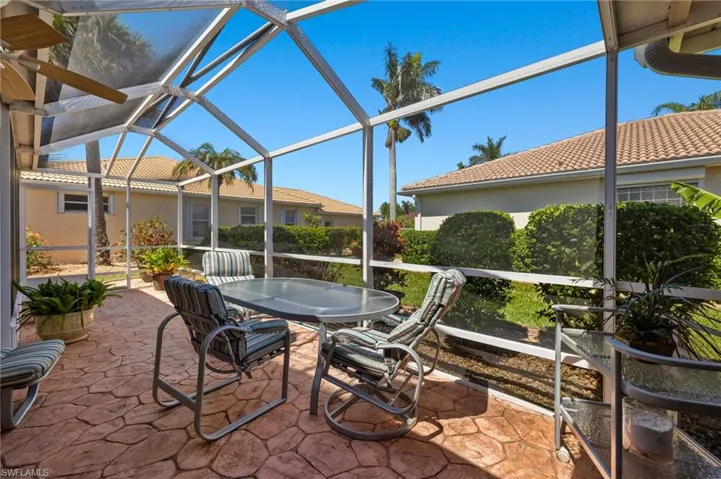 Sunroom / solarium featuring ceiling fan