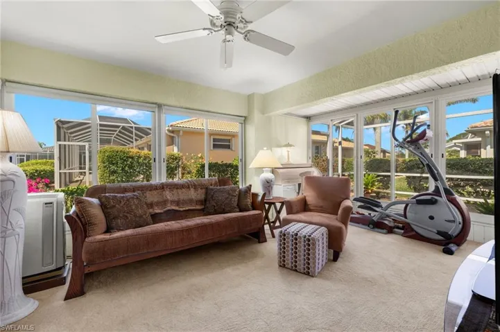 Sunroom with a ceiling fan