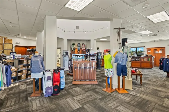 Misc room featuring rail lighting, a drop ceiling, visible vents, and carpet flooring