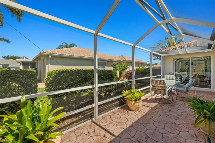 Unfurnished sunroom featuring lofted ceiling
