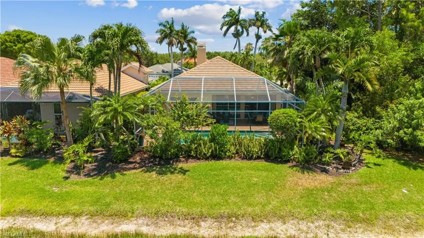 View of yard with glass enclosure