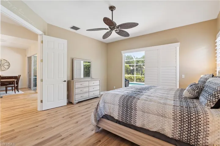 Bedroom with ceiling fan and light hardwood / wood-style flooring