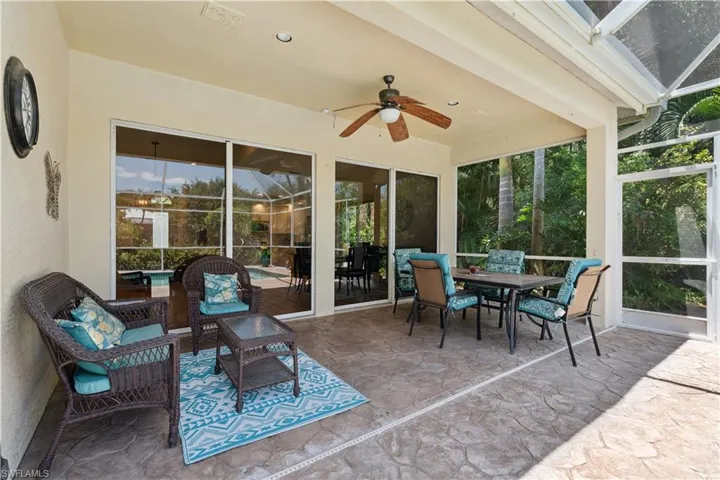 Sunroom featuring ceiling fan
