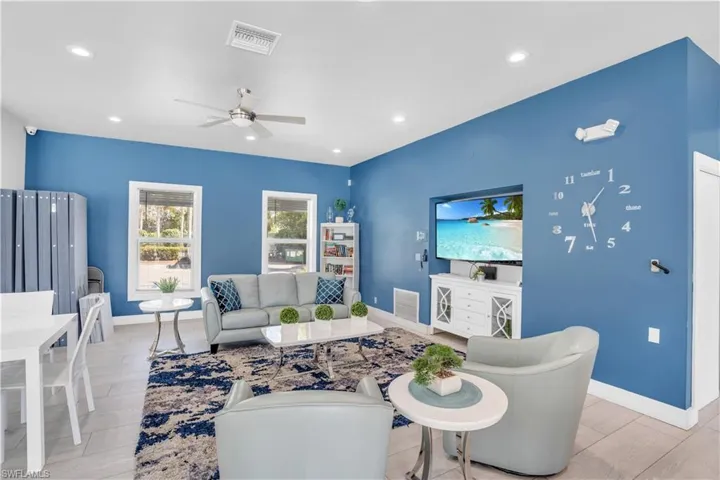 Living room featuring ceiling fan