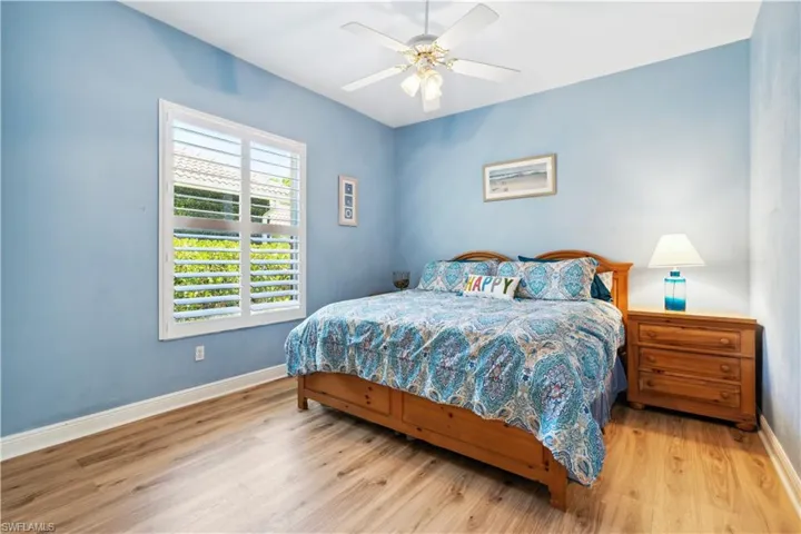 Bedroom with wood-type flooring and ceiling fan