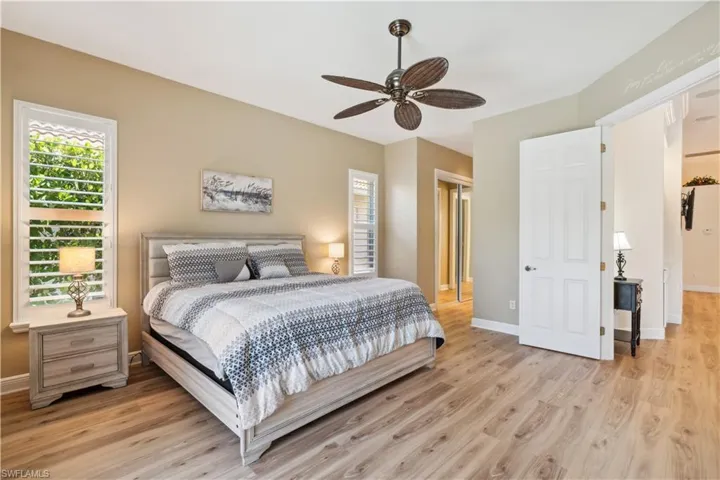 Bedroom with hardwood / wood-style flooring and ceiling fan