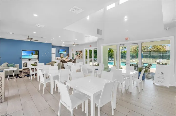 Dining room featuring light wood-type flooring, french doors, and ceiling fan