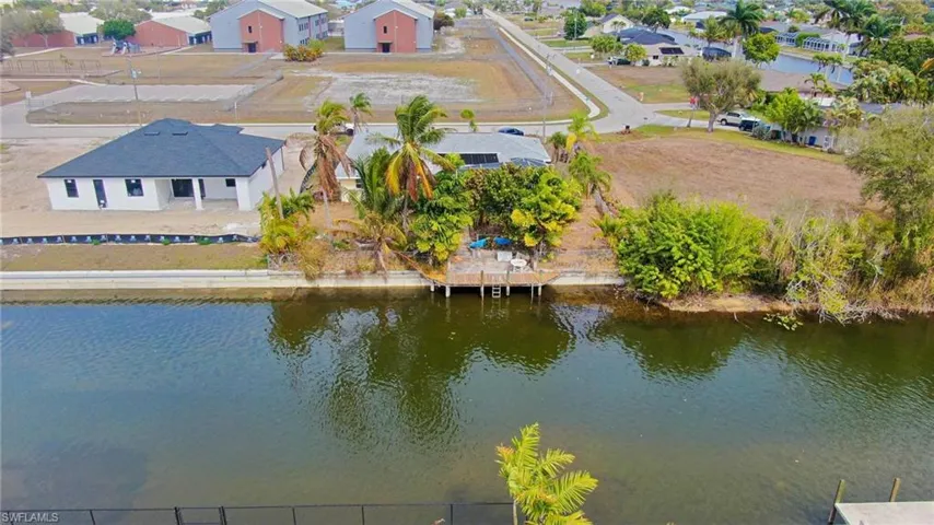 Aerial view of residential area featuring a large body of water