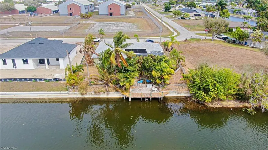 Aerial view of residential area with a large body of water