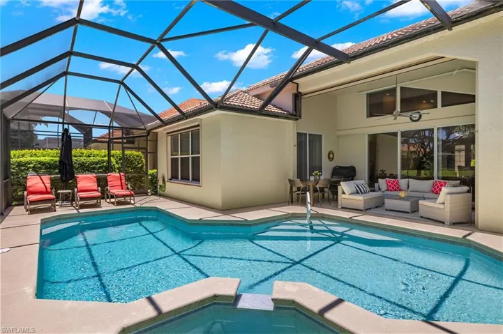 View of pool featuring a patio, an outdoor hangout area, and a lanai