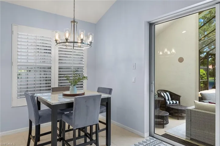 Dining area featuring an inviting chandelier and light tile floors