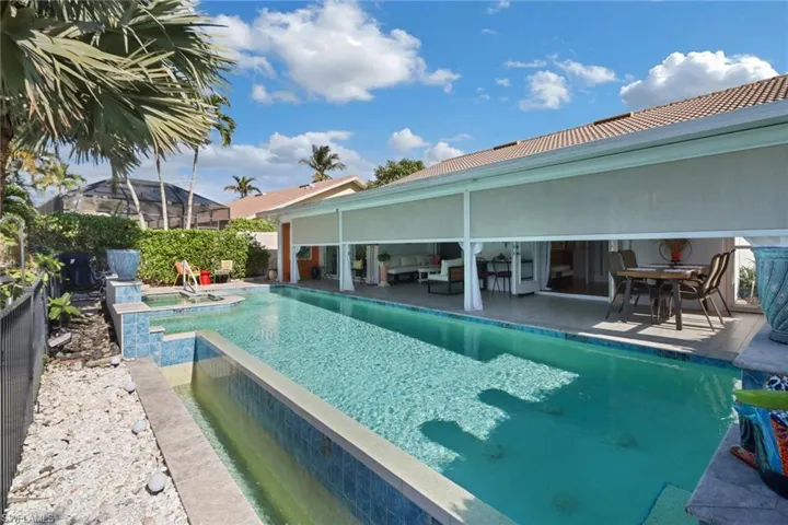View of pool featuring an in ground hot tub and a patio area