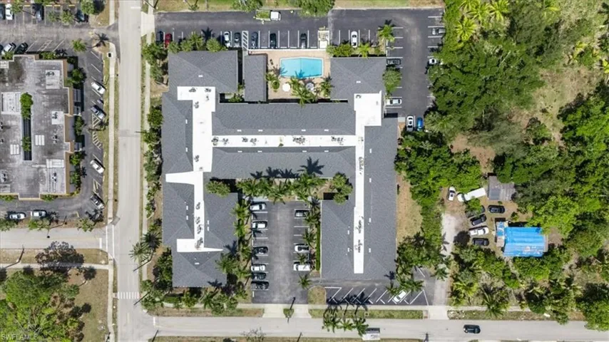 Aerial view of property's location featuring a pool
