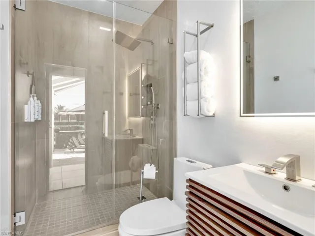 Bathroom with vanity and a shower stall
