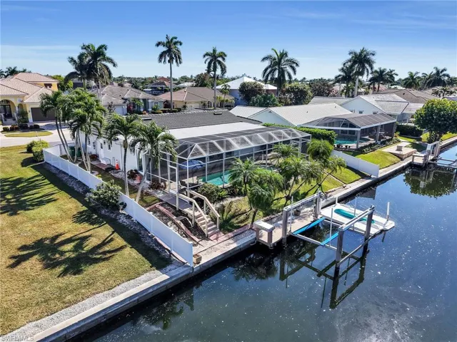 Aerial perspective of suburban area with a large body of water