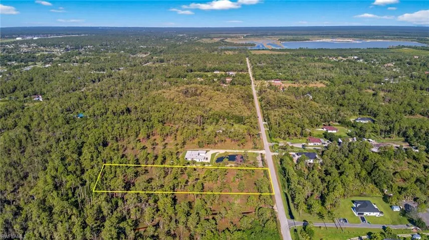 View of property location with a nearby body of water and property parcel outlined
