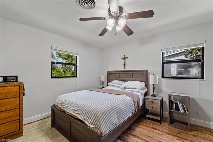 Bedroom featuring light hardwood / wood-style flooring and ceiling fan