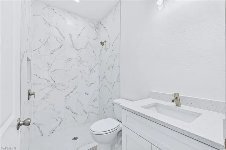 Spacious guest bathroom offering comfort and style for guests.