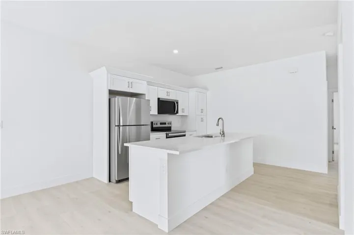 Enjoy effortless entertaining in this spacious living and kitchen area.