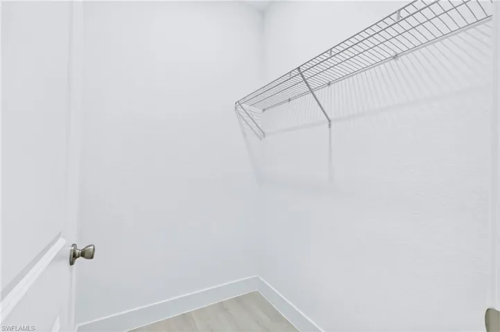 Spacious walk-in closet with ample storage and organization space.