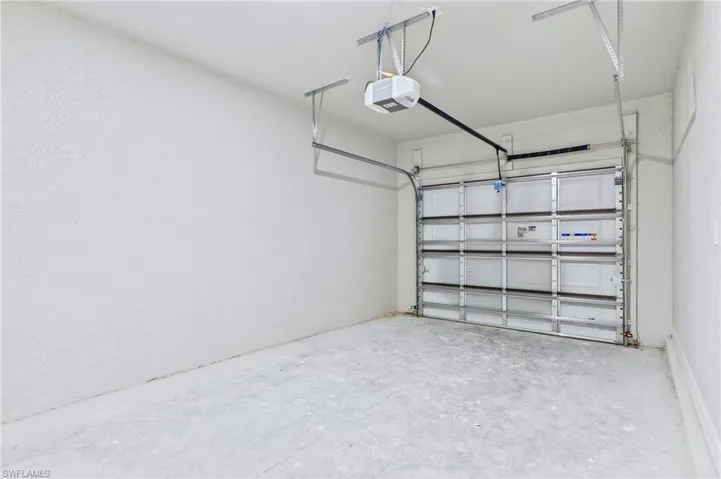 Attached 1-car garage with additional storage space.