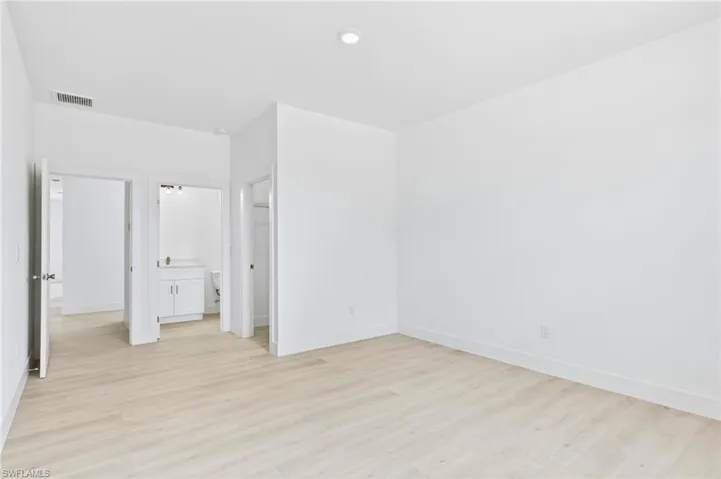 Elegant primary suite featuring a calming and inviting atmosphere.