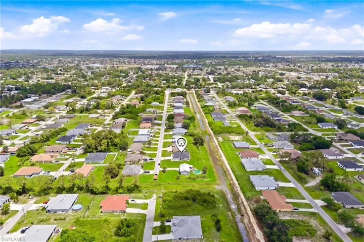 Prime canal-front setting offering privacy, views, and endless potential.