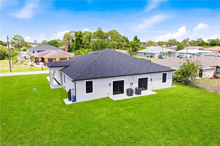 Drone view showcasing the backyard’s privacy and natural surroundings.