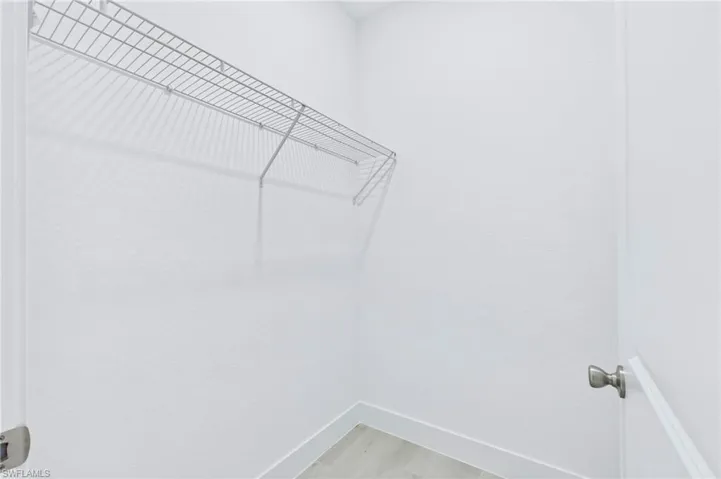Expansive walk-in closet perfect for organizing clothes and accessories.