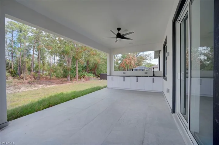 View of patio featuring a ceiling fan