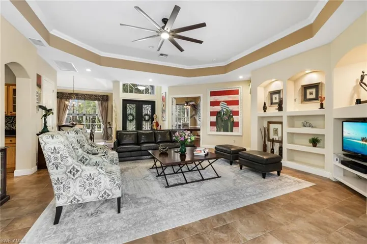 Large tray ceiling, crown moulding, & cooling tile floors