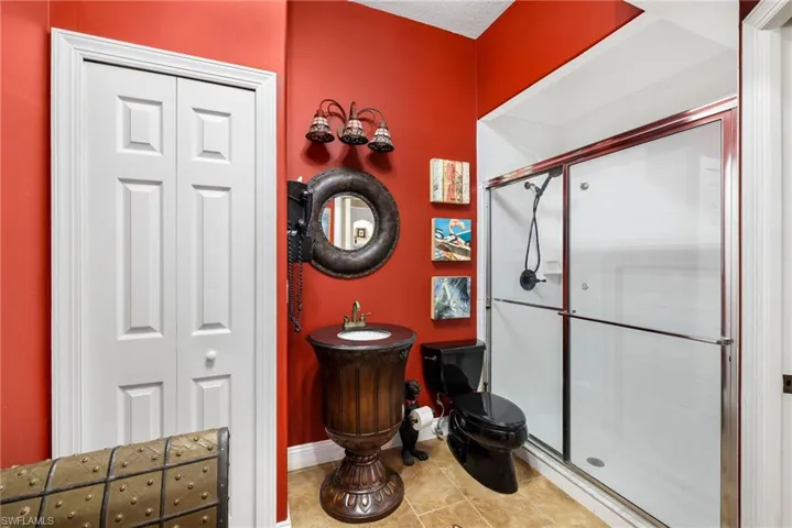 Easy access stand-up shower and a very unique vanity