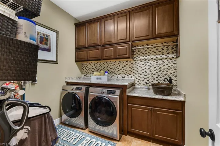 Even more cabinets in the expansive laundry room. No storage issues here