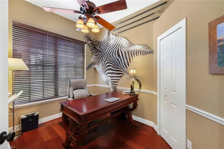 The Den/Office with rich pinewood floors