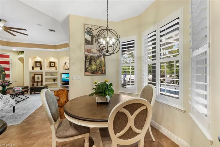 The secondary dining area with serene pool views