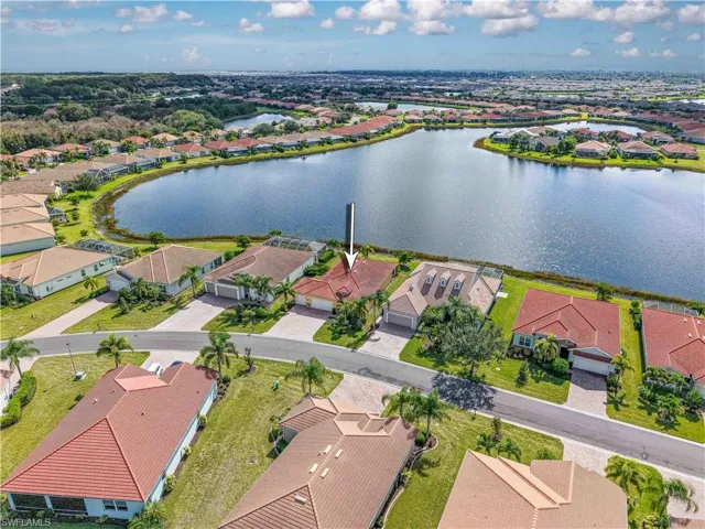 Aerial perspective of suburban area with a nearby body of water