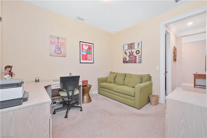 Office with light carpet, crown molding, and recessed lighting
