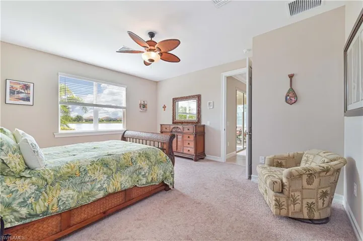 Bedroom with carpet flooring and ceiling fan