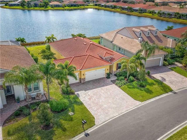 Aerial perspective of suburban area with a large body of water