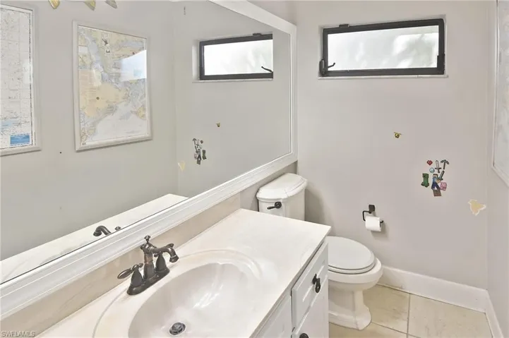Bathroom featuring vanity and light tile patterned floors