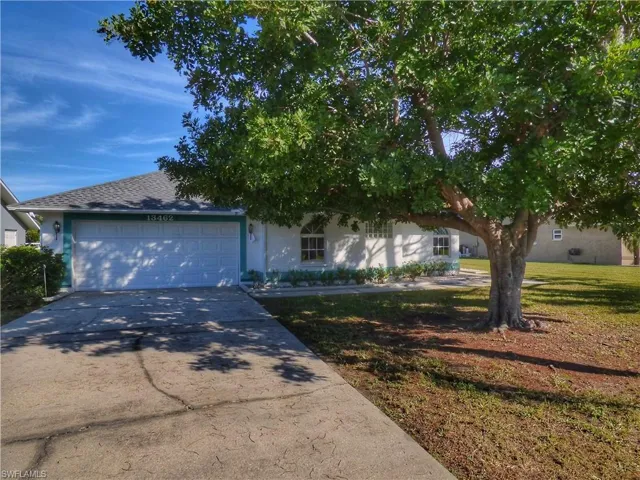 Front of Home With Shade Tree