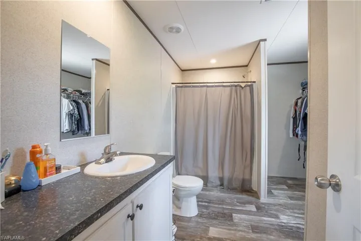 Bathroom with oversized vanity, toilet