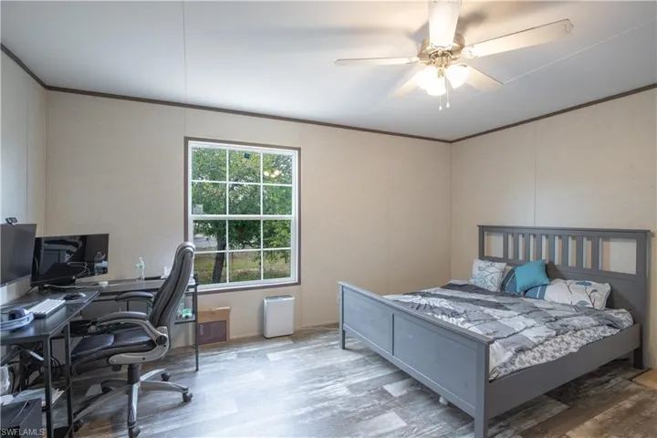 Bedroom featuring and ceiling fan