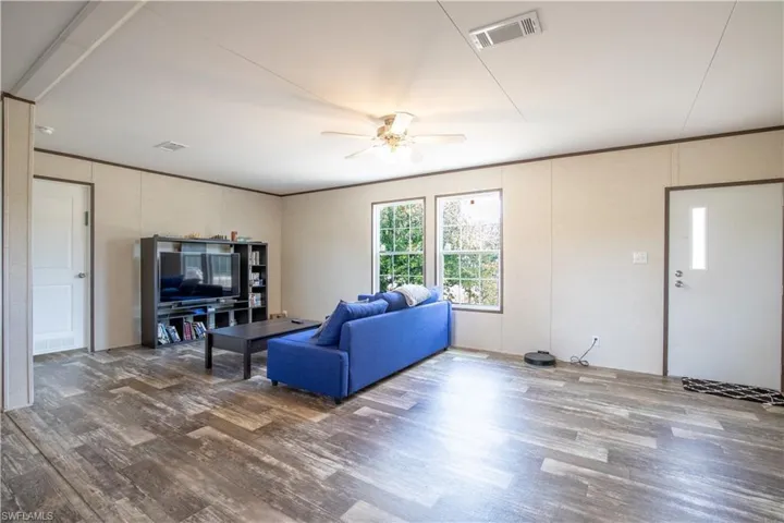 Living room featuring ceiling fan