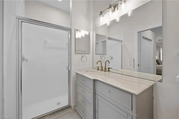 primary bathroom/upgraded vanity, lighting, paint, trim & flooring