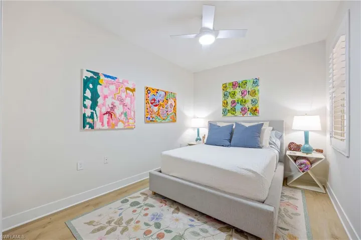 Bedroom featuring ceiling fan, wood finished floors, new upgraded baseboards