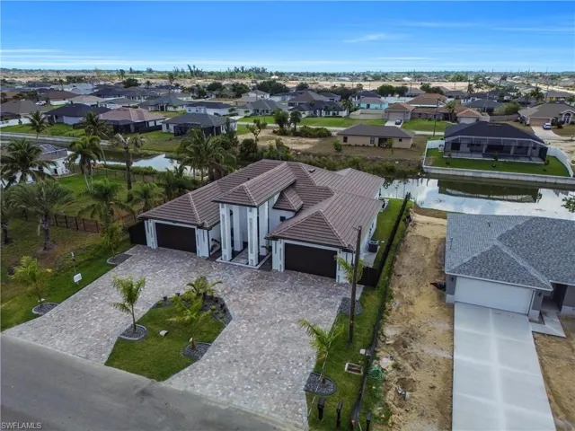 Aerial view of residential area with a nearby body of water