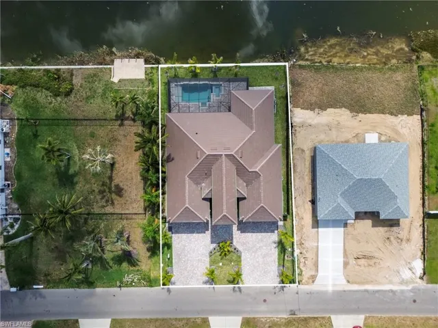 View of property location featuring property boundaries highlighted and a nearby body of water