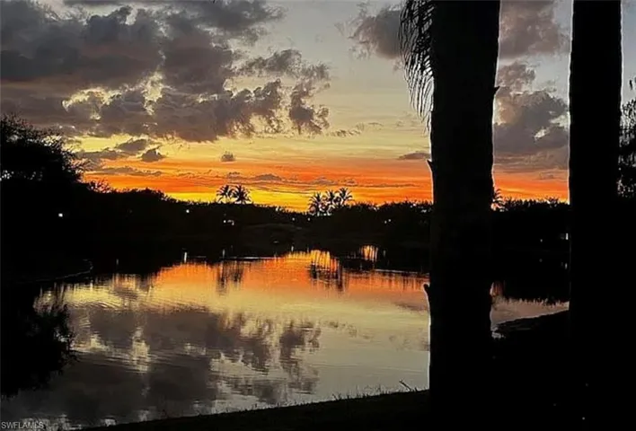 Nature at dusk featuring a water view