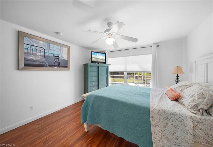 Bedroom featuring wood finished floors and ceiling fan